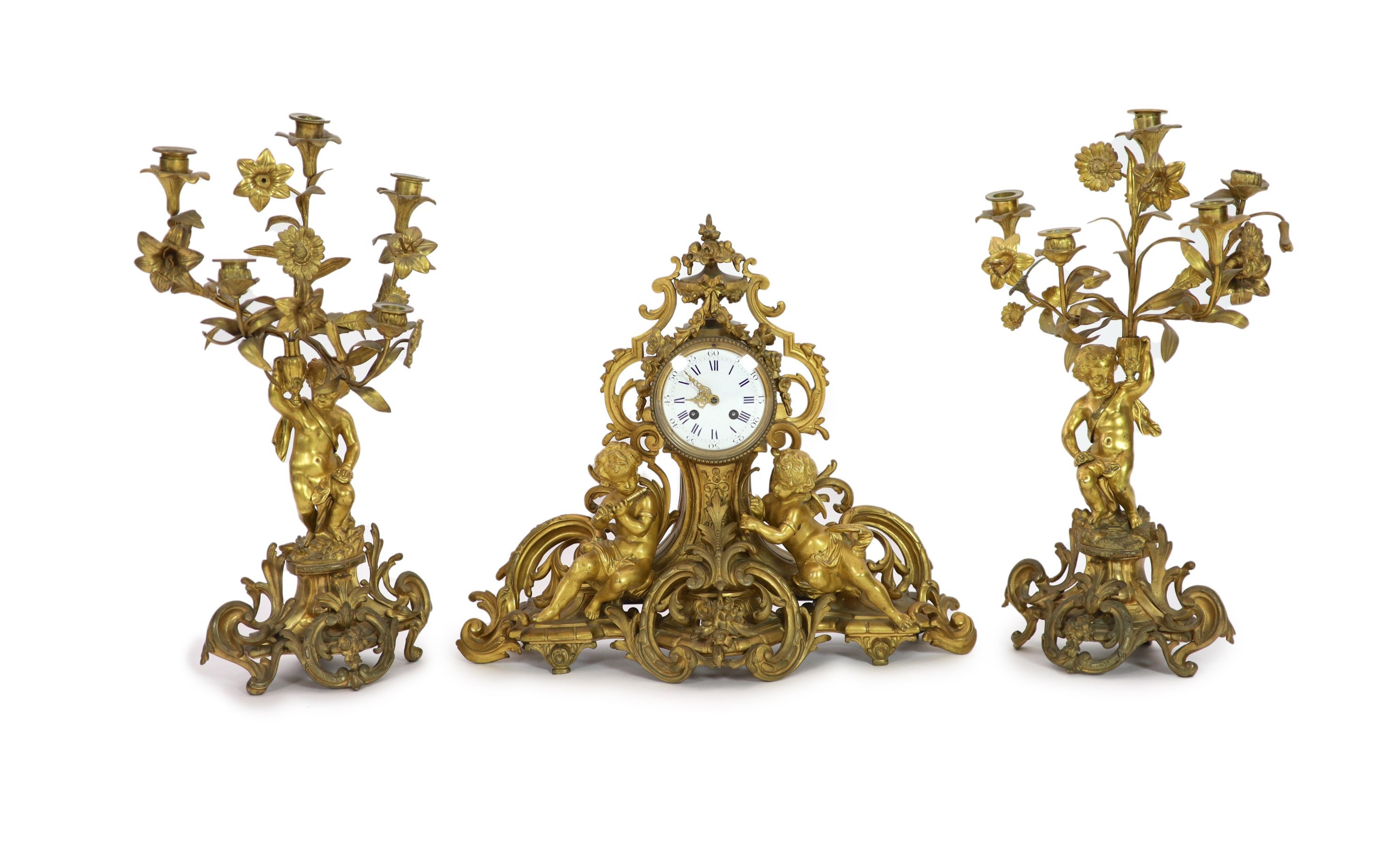 A 19th century Louis XV style ormolu clock garniture, clock H 43cm candelabra H 52cm